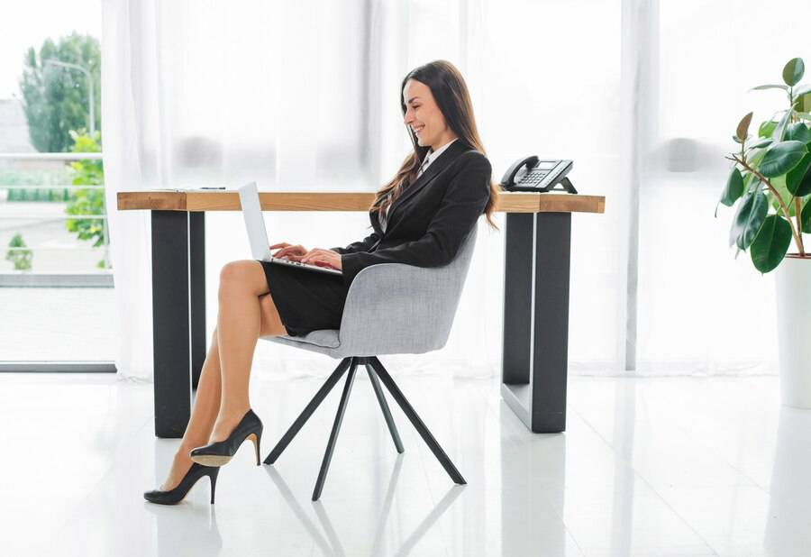 Side View Young Businesswoman Sitting Front Desk Using Digital Tablet 23 2147943748 (1)